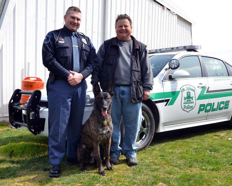 Officer Ben Helms and purpose PSD K9 "Duke" of the St. Johns, Michigan Police Department with breeder/trainer Cheryl Carlson